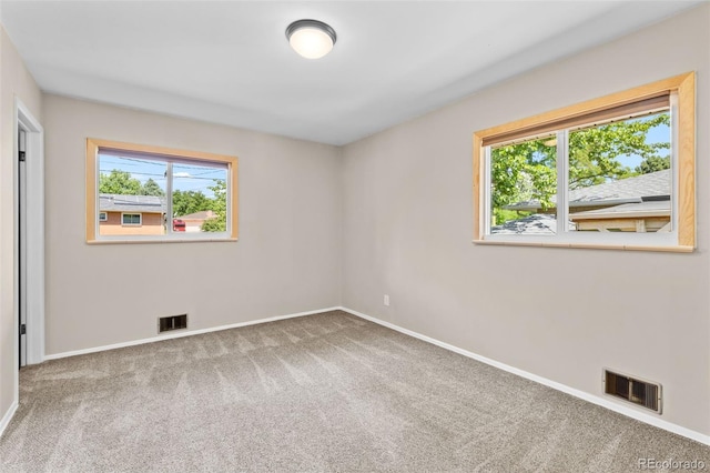 2101 Youngfield St, Golden, CO 80401 - unfurnished bedroom with multiple windows and carpet flooring
