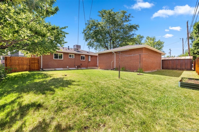 2101 Youngfield St, Golden, CO 80401 - back of house with a fenced backyard and brick siding
