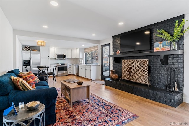 living room featuring recessed lighting and light wood-style floors