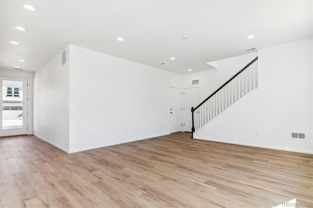 spare room with light hardwood / wood-style floors