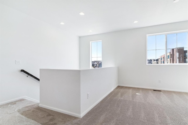 unfurnished room featuring carpet floors