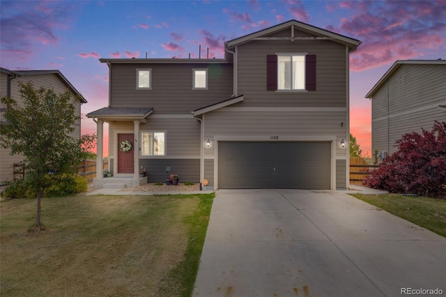 traditional-style home with a garage and driveway