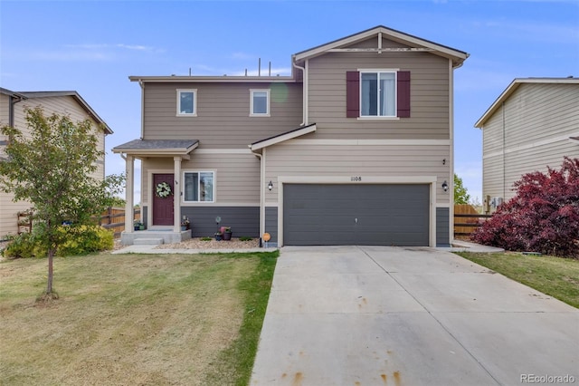 traditional-style house featuring concrete driveway and an attached garage