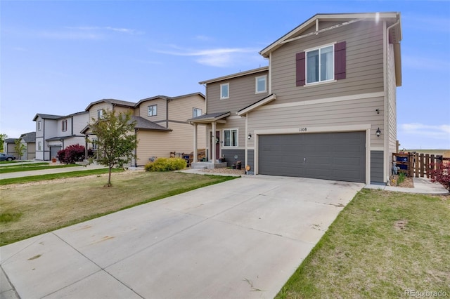 traditional-style home featuring an attached garage, driveway, and a residential view