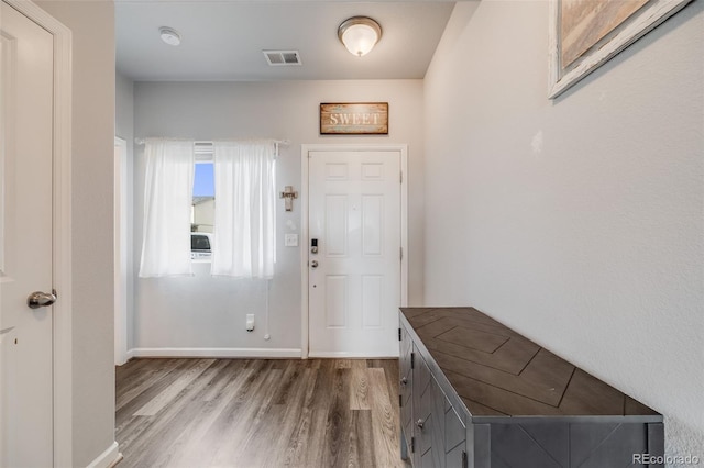 entrance foyer with wood finished floors and baseboards