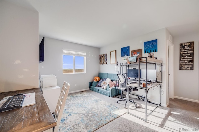 carpeted home office with baseboards