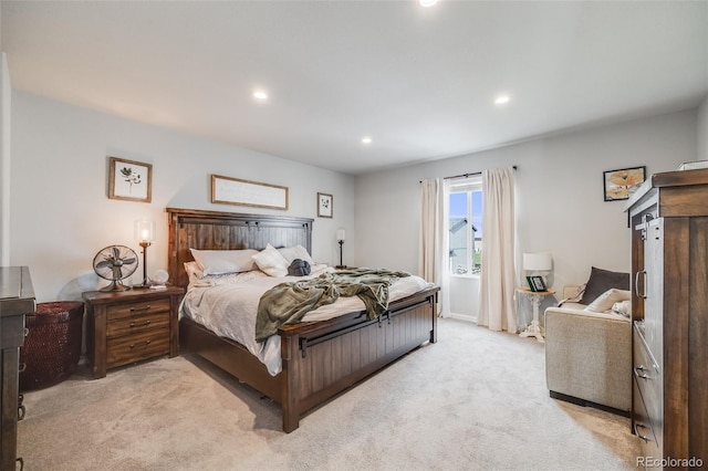bedroom featuring light colored carpet and recessed lighting