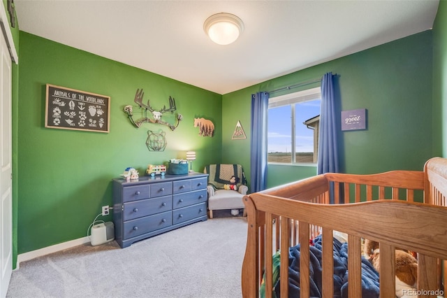 bedroom featuring carpet flooring and baseboards