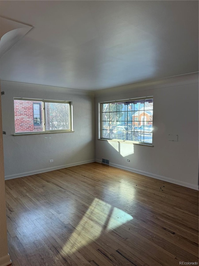 spare room with light hardwood / wood-style flooring