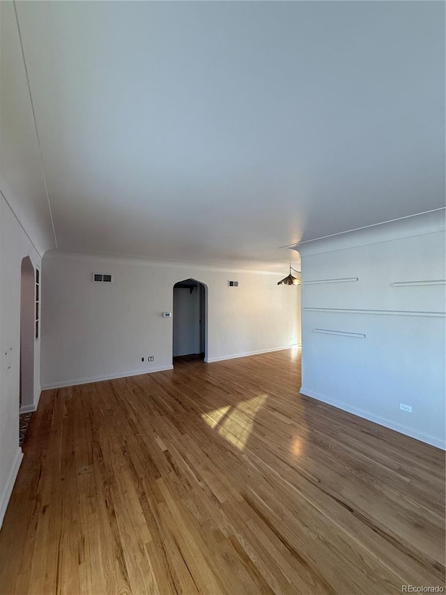 unfurnished living room with light hardwood / wood-style floors