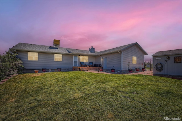 7716 Shenandoah Dr, Elizabeth, CO 80107 - back of property featuring a lawn and a chimney