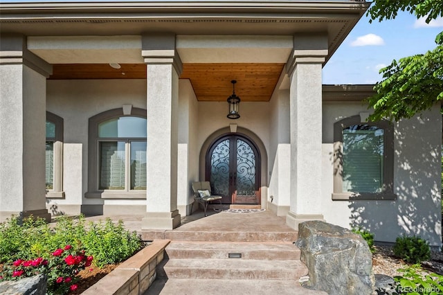 2378 Plumb Pl, Erie, CO 80516 - doorway to property featuring stucco siding, french doors, and a porch