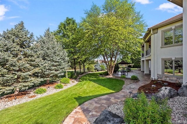 2378 Plumb Pl, Erie, CO 80516 - view of green lawn featuring a gazebo and a patio