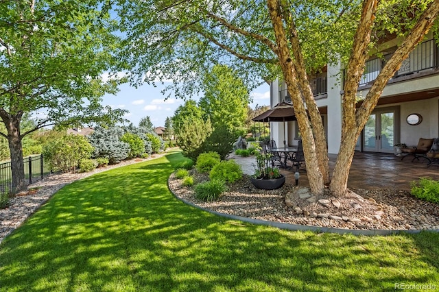 2378 Plumb Pl, Erie, CO 80516 - view of yard featuring french doors, a patio area, and a balcony