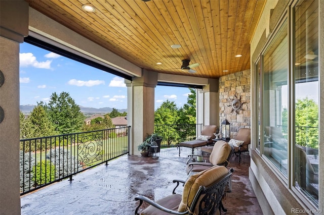2378 Plumb Pl, Erie, CO 80516 - sunroom / solarium featuring wooden ceiling, recessed lighting, and a mountain view
