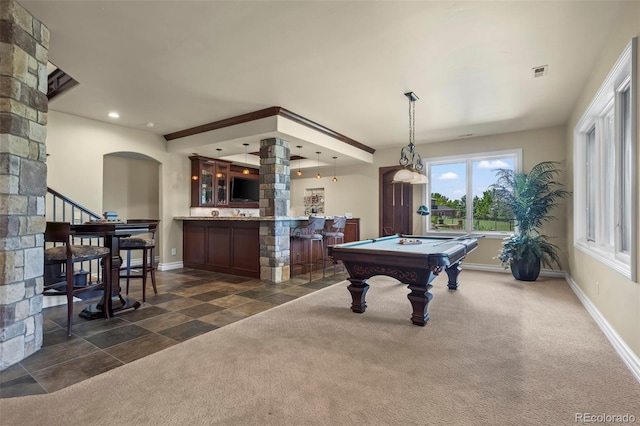 2378 Plumb Pl, Erie, CO 80516 - playroom featuring billiards, arched walkways, bar area, ornate columns, and dark colored carpet