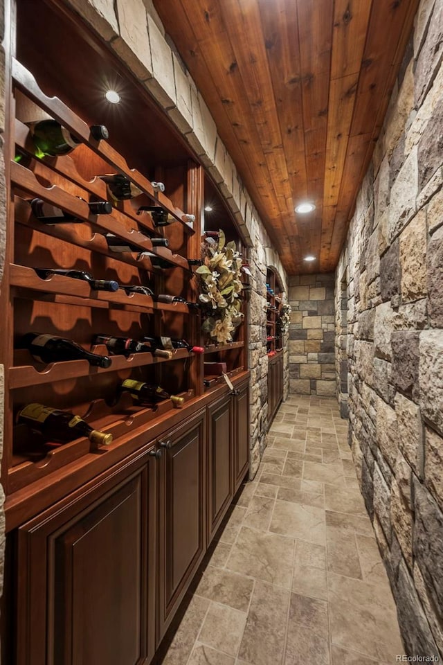 2378 Plumb Pl, Erie, CO 80516 - wine cellar featuring stone tile flooring and wood ceiling
