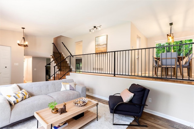 1168 E Kettle Pl, Centennial, CO 80122 - living room featuring wood finished floors, a chandelier, and stairway