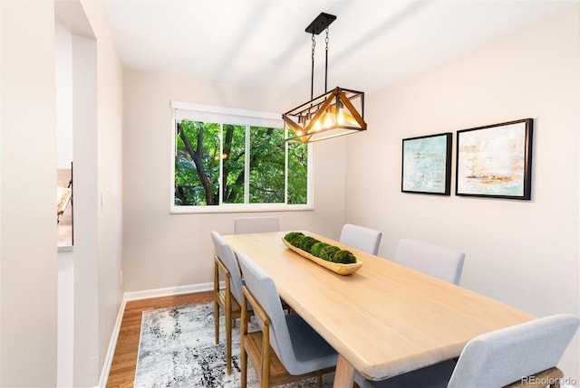1168 E Kettle Pl, Centennial, CO 80122 - dining area featuring wood finished floors and a chandelier