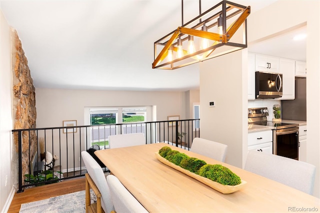 1168 E Kettle Pl, Centennial, CO 80122 - dining space featuring light wood finished floors and baseboards