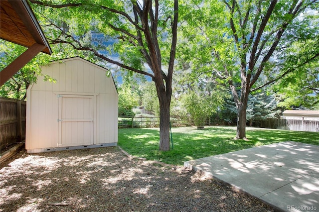 1168 E Kettle Pl, Centennial, CO 80122 - fenced backyard with a storage unit and a patio area