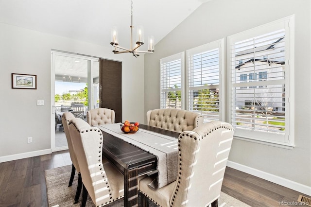 8102 Adams Fork Ave, Littleton, CO 80125 - dining room with a chandelier, healthy amount of natural light, vaulted ceiling, and baseboards