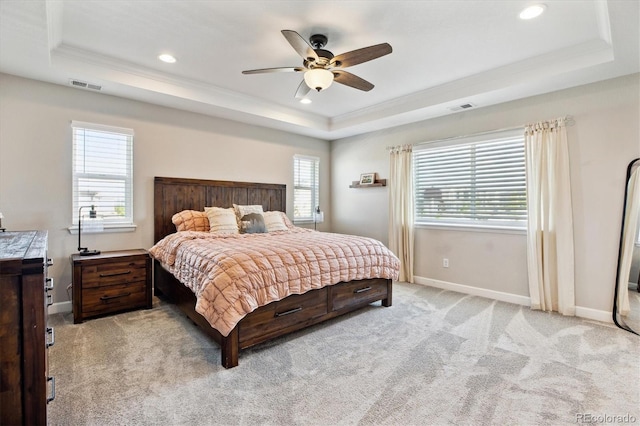 8102 Adams Fork Ave, Littleton, CO 80125 - bedroom featuring a tray ceiling, multiple windows, light carpet, ornamental molding, and recessed lighting