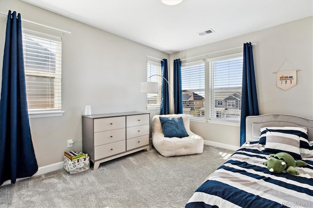8102 Adams Fork Ave, Littleton, CO 80125 - carpeted bedroom featuring multiple windows and baseboards