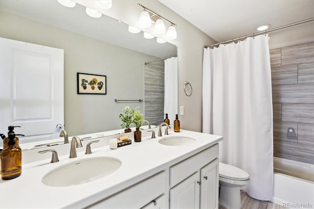 8102 Adams Fork Ave, Littleton, CO 80125 - bathroom with double vanity, toilet, and shower / tub combo