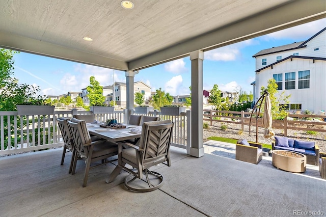 8102 Adams Fork Ave, Littleton, CO 80125 - view of patio featuring outdoor dining area, a residential view, and an outdoor living space