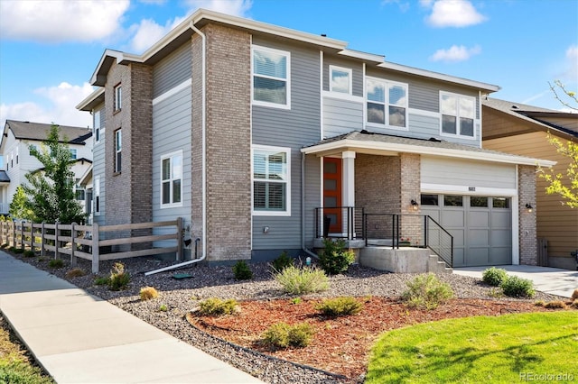 8102 Adams Fork Ave, Littleton, CO 80125 - view of front of house featuring driveway, a garage, and brick siding