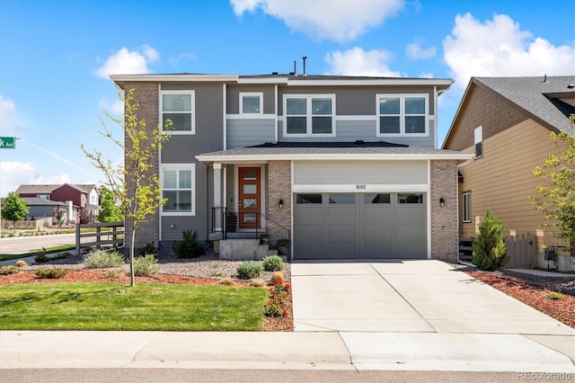 8102 Adams Fork Ave, Littleton, CO 80125 - view of front of property featuring a garage, concrete driveway, and brick siding