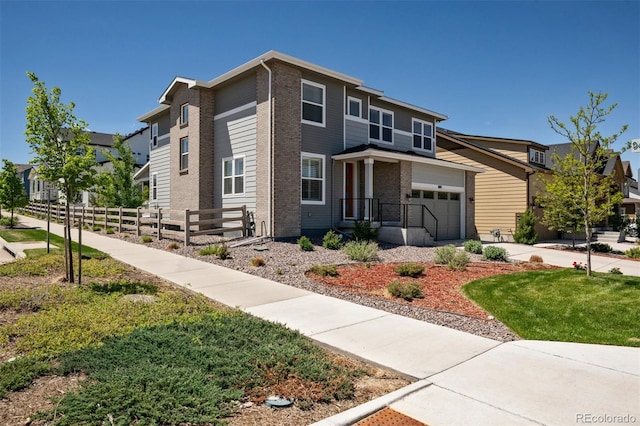 8102 Adams Fork Ave, Littleton, CO 80125 - view of front of home featuring a garage, driveway, and brick siding