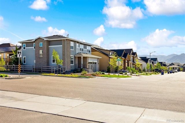 8102 Adams Fork Ave, Littleton, CO 80125 - view of front facade featuring a residential view, a garage, and brick siding