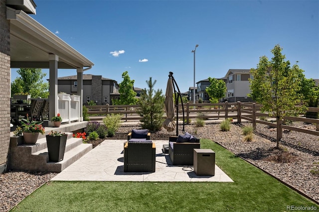 8102 Adams Fork Ave, Littleton, CO 80125 - fenced backyard featuring a residential view, a patio area, and an outdoor living space