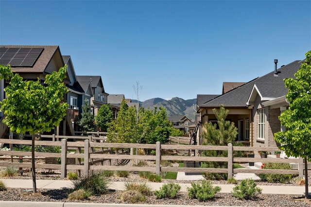 8102 Adams Fork Ave, Littleton, CO 80125 - fenced front yard featuring a mountain view