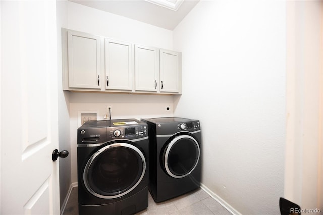 washroom with independent washer and dryer, cabinet space, baseboards, and light tile patterned floors