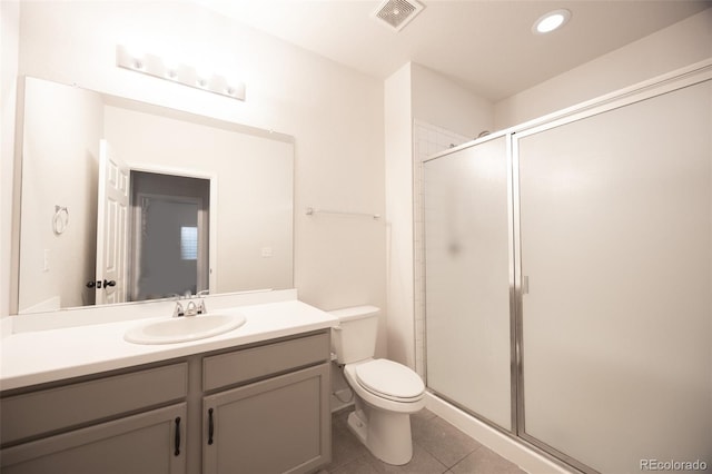 full bath with tile patterned floors, a shower stall, toilet, vanity, and recessed lighting