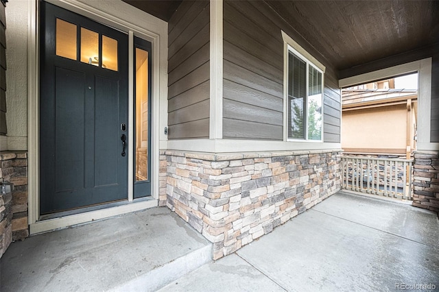 12652 Glencoe St, Thornton, CO 80241 - view of exterior entry with a porch and stone siding