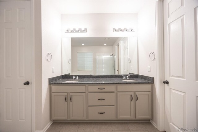 12652 Glencoe St, Thornton, CO 80241 - full bathroom featuring double vanity, tile patterned floors, and an enclosed shower