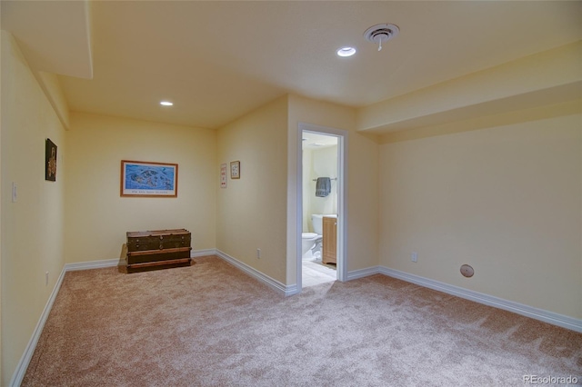 interior space with carpet flooring, recessed lighting, baseboards, and visible vents