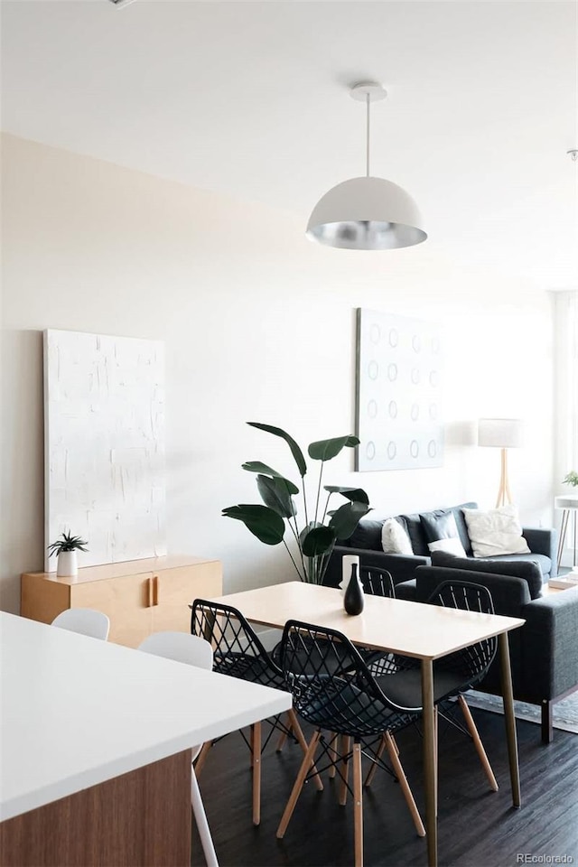 dining room with dark wood-style floors