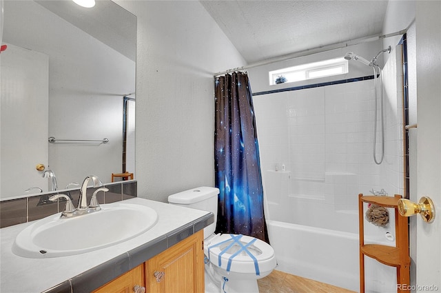 full bathroom with vanity, toilet, a textured ceiling, and shower / tub combo