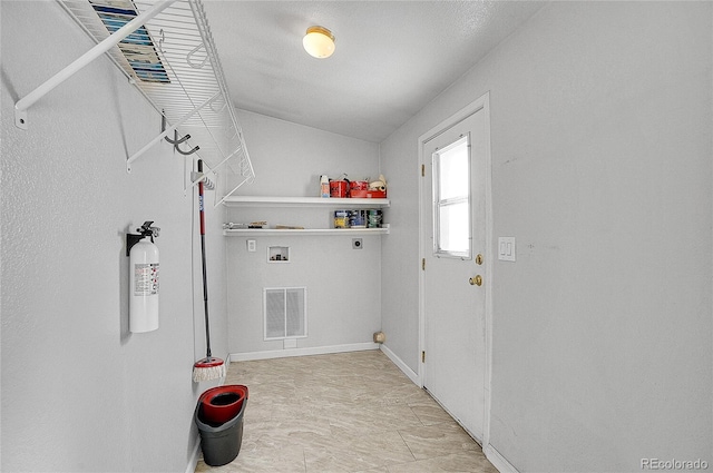 clothes washing area with electric dryer hookup and washer hookup