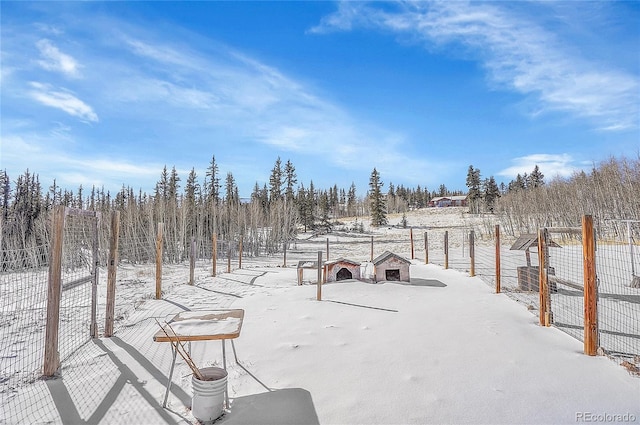 view of yard covered in snow