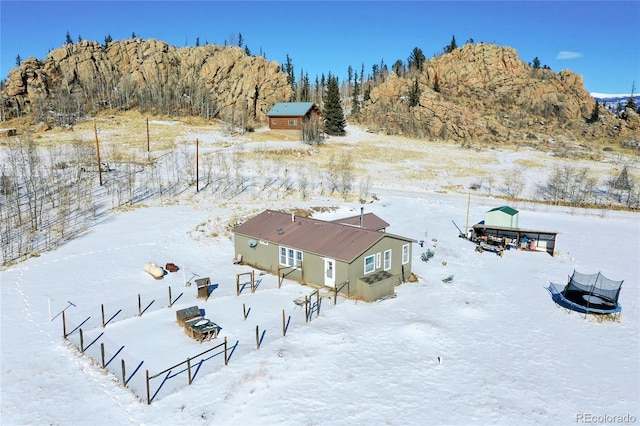 snowy aerial view featuring a mountain view