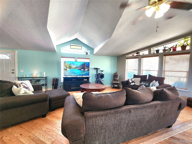 160 Shannon Ct, Rockvale, CO 81244 - living area featuring vaulted ceiling, light wood-style floors, ceiling fan, a textured ceiling, and plenty of natural light