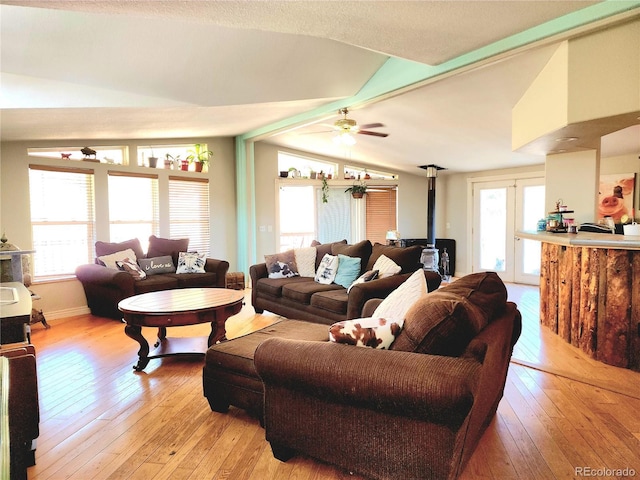 160 Shannon Ct, Rockvale, CO 81244 - living area featuring a wood stove, vaulted ceiling, light wood finished floors, and a ceiling fan