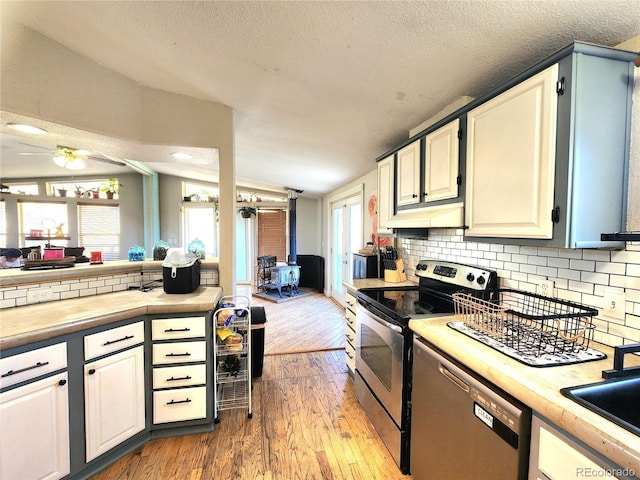 160 Shannon Ct, Rockvale, CO 81244 - kitchen with stainless steel range with electric cooktop, a ceiling fan, light countertops, dishwashing machine, and open floor plan