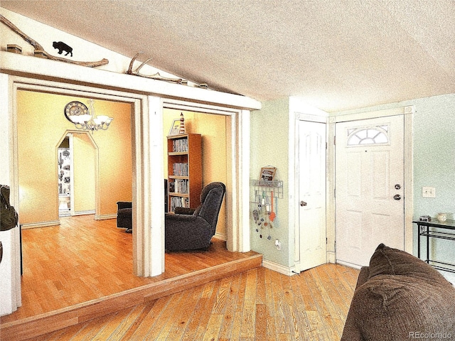 160 Shannon Ct, Rockvale, CO 81244 - entryway featuring wood finished floors, a textured ceiling, and arched walkways